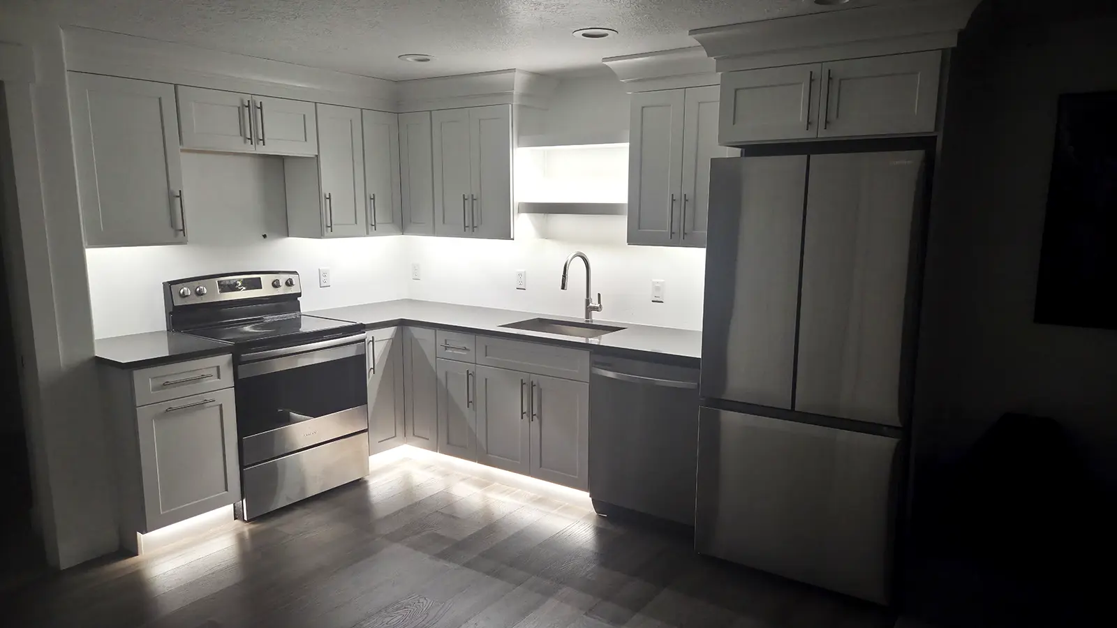 Finished basement kitchen with lighting and electrical installation completed by Camson Electric in Utah